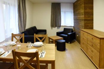 EFI ApartHotel Horní Lipová - living room with dining table